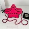 Chanel 24C Fuchsia Satin Walk of Fame Star Bag with Black Lacquered Hardware.