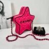 Chanel 24C Fuchsia Satin Walk of Fame Star Bag with Black Lacquered Hardware.