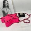 Chanel 24C Fuchsia Satin Walk of Fame Star Bag with Black Lacquered Hardware.