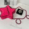 Chanel 24C Fuchsia Satin Walk of Fame Star Bag with Black Lacquered Hardware.