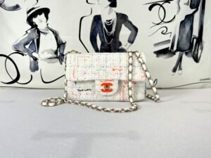 Chanel 24C White Tweed Mini Flap with Orange Enamel CC and Champagne Gold Hardware.