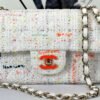 Chanel 24C White Tweed Mini Flap with Orange Enamel CC and Champagne Gold Hardware.