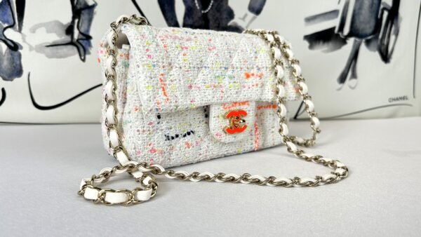 Chanel 24C White Tweed Mini Flap with Orange Enamel CC and Champagne Gold Hardware.