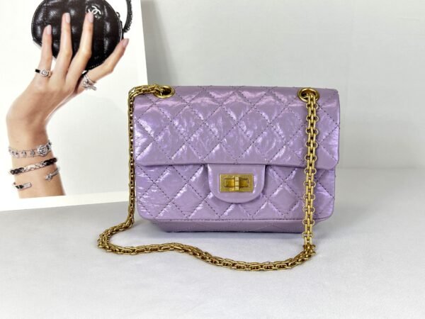 Chanel 24P Light Purple Aged Calfskin Mini Reissue with Matte Gold Hardware.