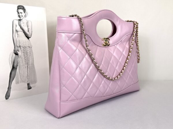 Chanel 24S Light Purple Shiny Lambskin Medium 31 Bag with Champagne Gold Hardware.