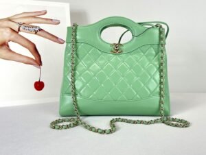 Chanel 24S Green Shiny Lambskin Mini 31 Bag with Champagne Gold Hardware.