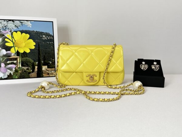 Chanel 24S Yellow Iridescent Lambskin Pearl Twin Flap Bag.