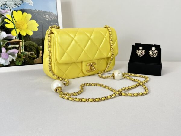 Chanel 24S Yellow Iridescent Lambskin Pearl Twin Flap Bag.