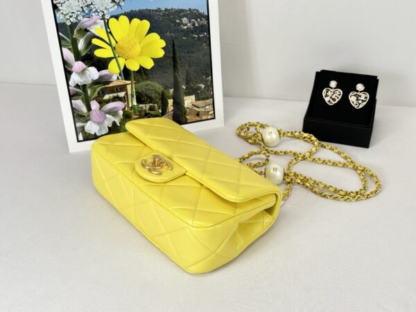 Chanel 24S Yellow Iridescent Lambskin Pearl Twin Flap Bag.