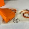 Hermès Orange Chevre Mini Bolide with Palladium Hardware.